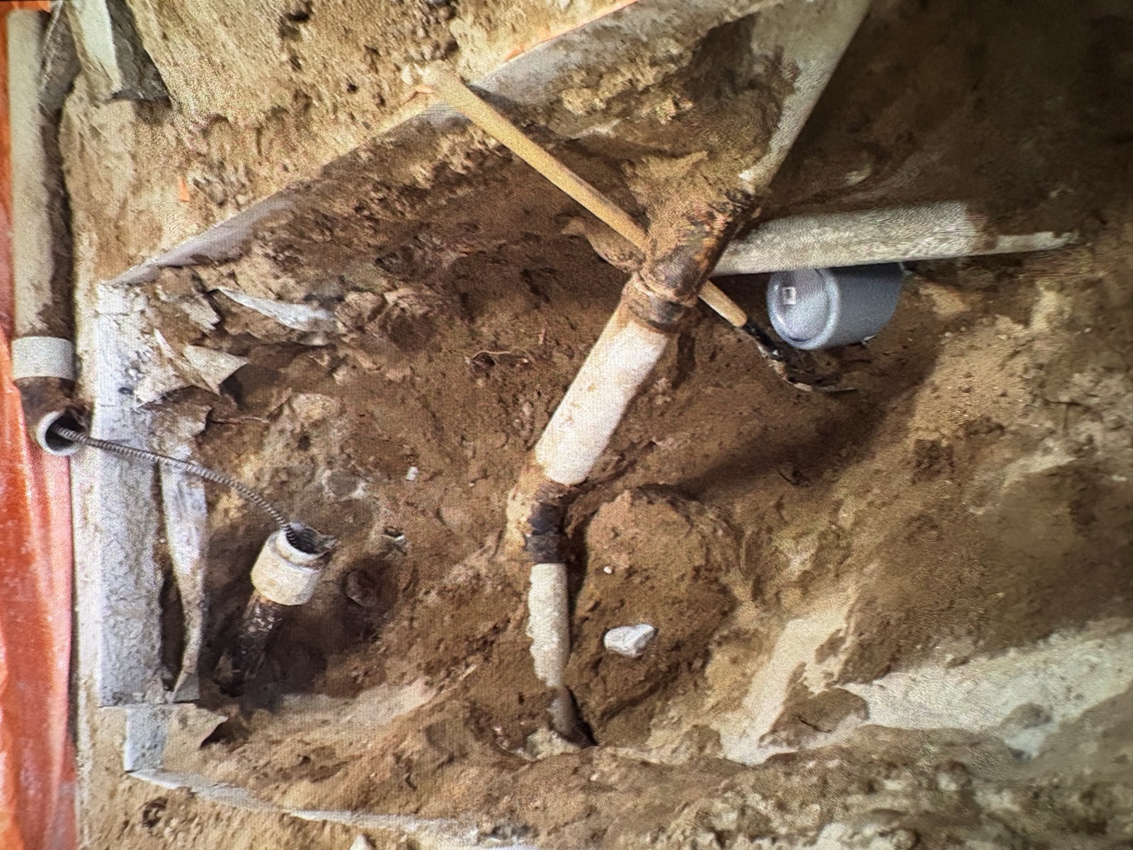 Real Thomas Plumbing job. Excavated clay sewer lateral exposed during a North Bay repair, the kind of defect Tyler's camera inspection locates before excavation.